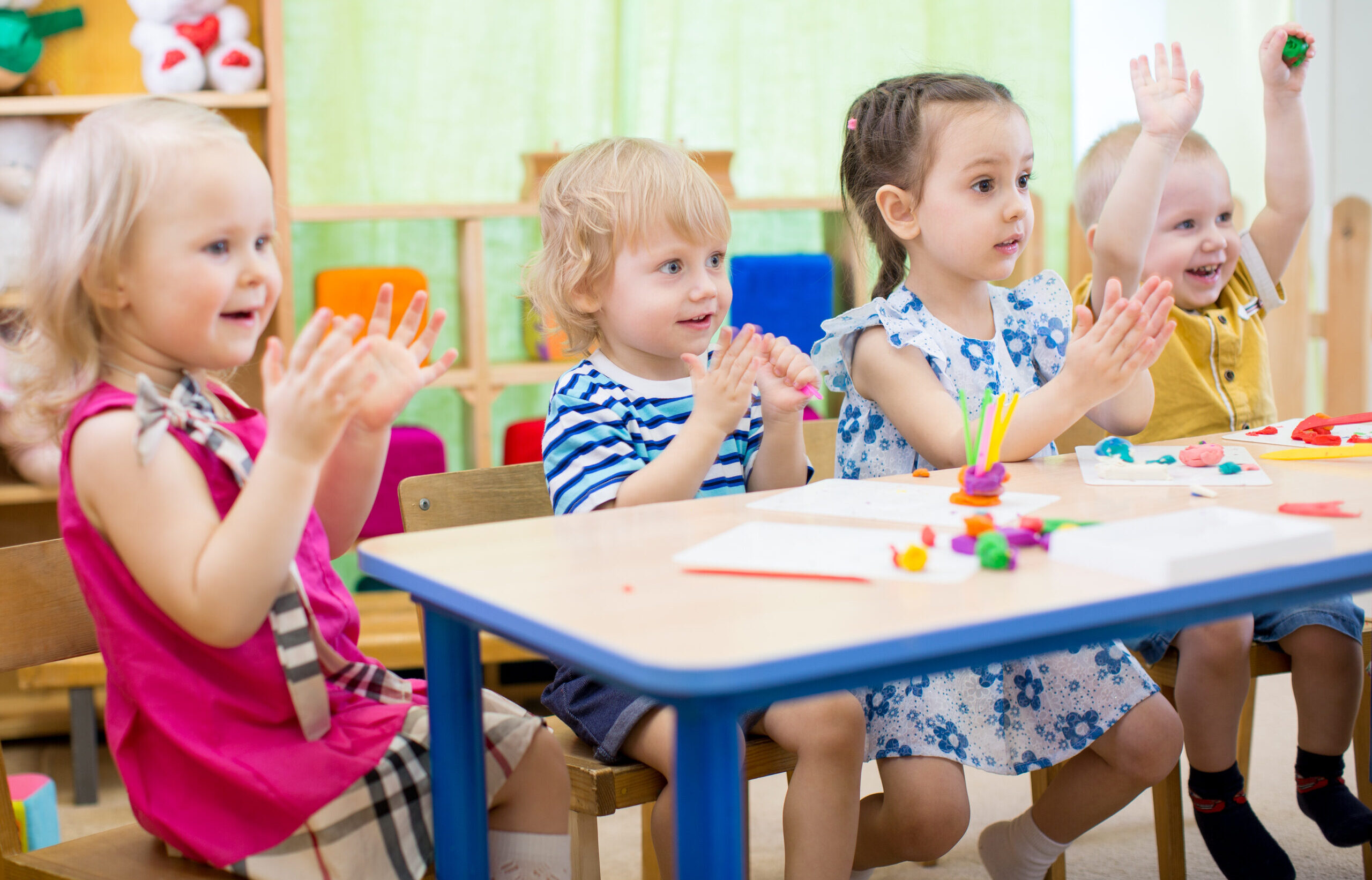 EYFS children sitting at tables